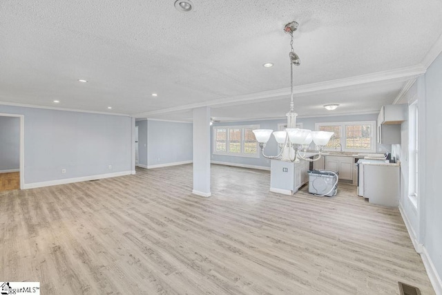 139 Randolph Ct, Woodruff, SC 29388 - unfurnished living room with a chandelier, visible vents, a textured ceiling, and light wood-type flooring