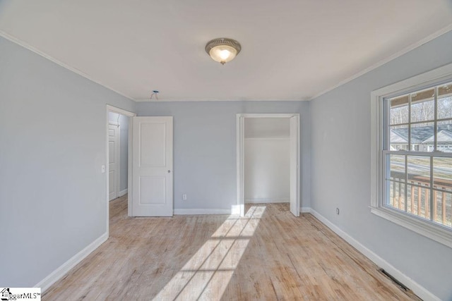139 Randolph Ct, Woodruff, SC 29388 - unfurnished bedroom with a closet, light wood-type flooring, baseboards, and ornamental molding
