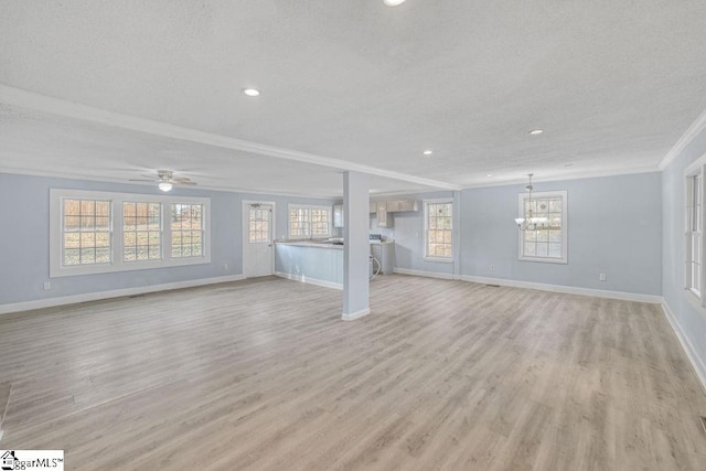 139 Randolph Ct, Woodruff, SC 29388 - unfurnished living room with light wood-style flooring, a textured ceiling, baseboards, and ornamental molding