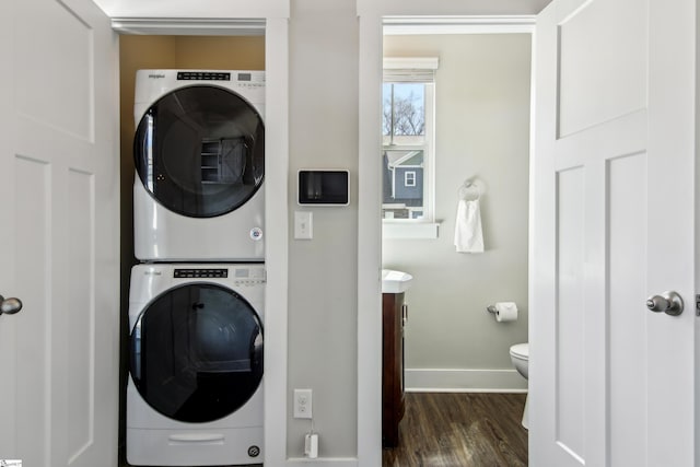 31 Creekhaven Ln, Taylors, SC 29687 - washroom with stacked washer and dryer, dark wood-style floors, and baseboards