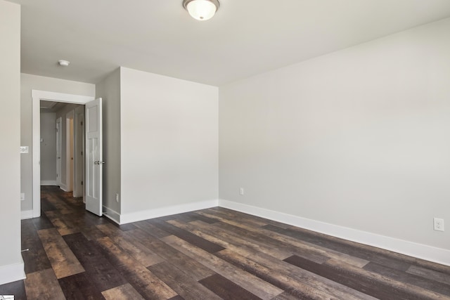 31 Creekhaven Ln, Taylors, SC 29687 - spare room with baseboards and dark wood-style flooring