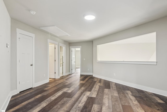 31 Creekhaven Ln, Taylors, SC 29687 - spare room featuring attic access, wood finished floors, and baseboards