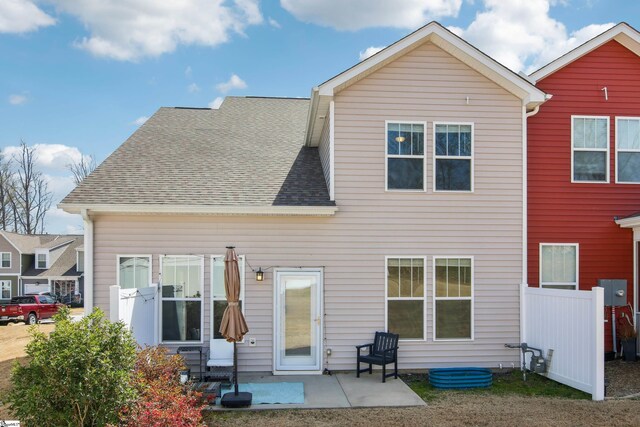 31 Creekhaven Ln, Taylors, SC 29687 - rear view of house with fence, a shingled roof, and a patio area