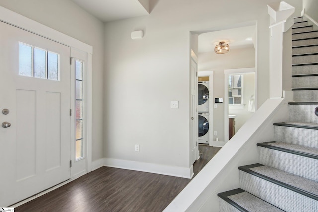 31 Creekhaven Ln, Taylors, SC 29687 - entryway featuring stairway, stacked washer and clothes dryer, dark wood-type flooring, and baseboards