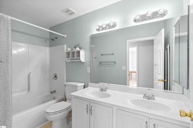 full bathroom with a sink, visible vents, toilet, and double vanity