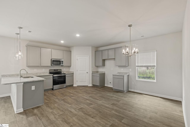 200 Clinkscales Rd Lot 37, Anderson, SC 29624 - kitchen featuring stainless steel appliances, gray cabinetry, a peninsula, baseboards, and a sink