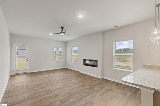 200 Clinkscales Rd Lot 37, Anderson, SC 29624 - unfurnished living room with ceiling fan, plenty of natural light, light wood finished floors, baseboards, and recessed lighting