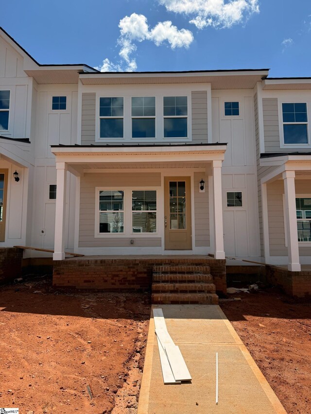 35 Leander Dr, Greer, SC 29651 - view of front of property with board and batten siding and covered porch