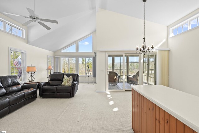 1230 Melton Rd Unit 101, West Union, SC 29696 - living area featuring high vaulted ceiling, ceiling fan with notable chandelier, and light colored carpet