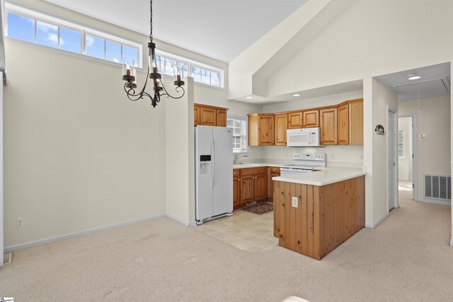 1230 Melton Rd Unit 101, West Union, SC 29696 - kitchen featuring light countertops, visible vents, white appliances, light carpet, and an inviting chandelier