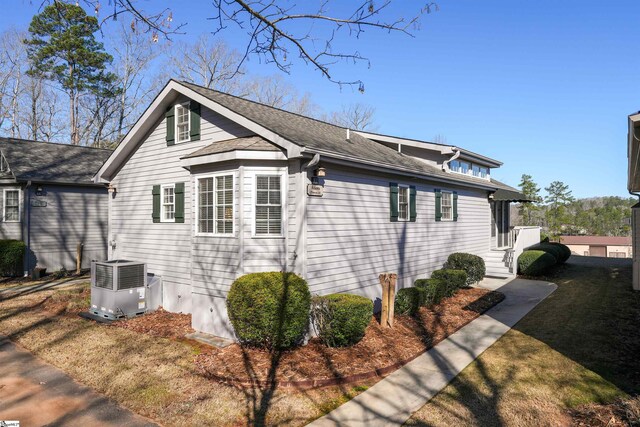 1230 Melton Rd Unit 101, West Union, SC 29696 - view of home's exterior featuring a shingled roof and central AC unit