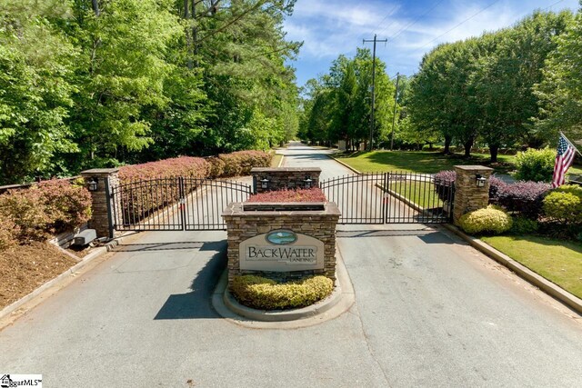 1230 Melton Rd Unit 101, West Union, SC 29696 - view of street with a gate, a gated entry, and curbs
