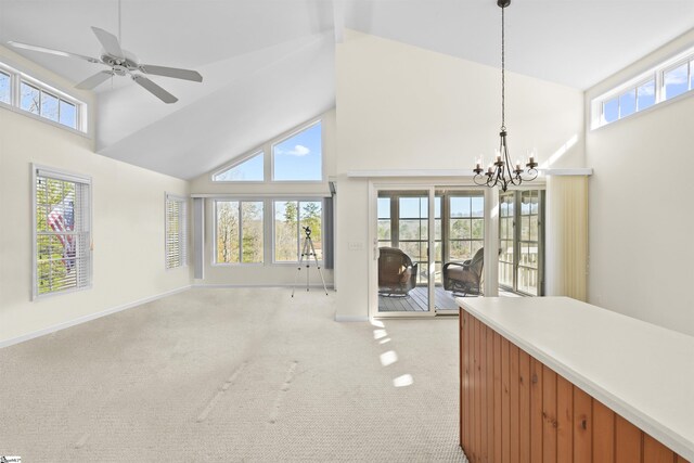 1230 Melton Rd Unit 101, West Union, SC 29696 - unfurnished living room featuring ceiling fan with notable chandelier, high vaulted ceiling, baseboards, and light colored carpet