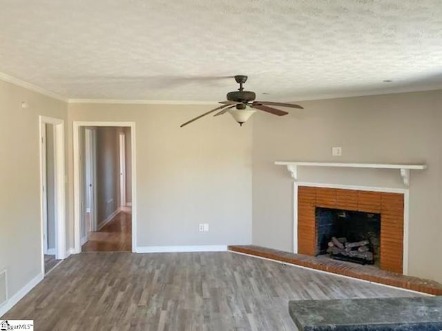 unfurnished living room featuring ornamental molding, baseboards, a textured ceiling, ceiling fan, and wood finished floors