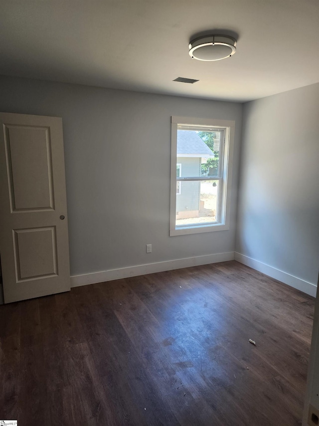 200 Broadus St, Greer, SC 29651 - empty room featuring dark wood-style floors and baseboards