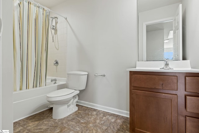 bathroom with shower / tub combo, vanity, baseboards, and toilet
