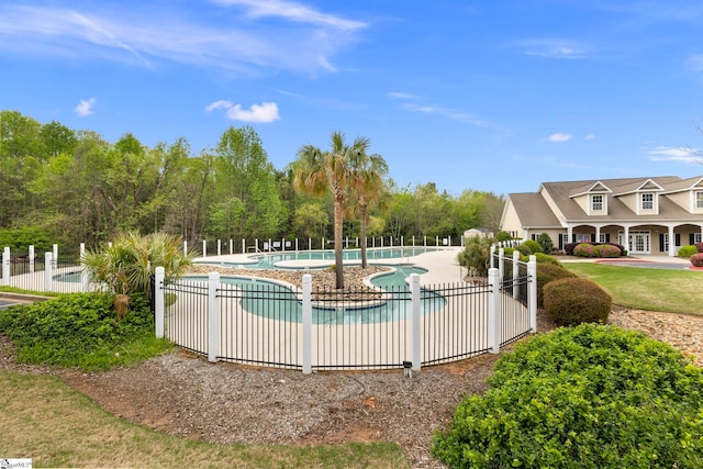 community pool featuring fence