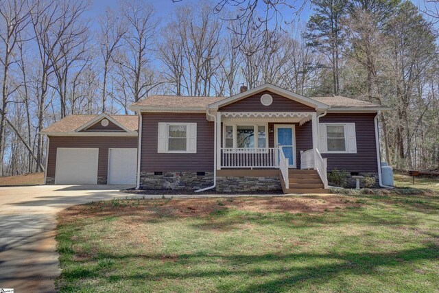 bungalow-style home featuring a front yard, a porch, concrete driveway, and an attached garage