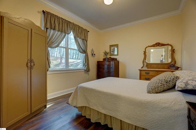 bedroom featuring baseboards, crown molding, and dark wood-style flooring