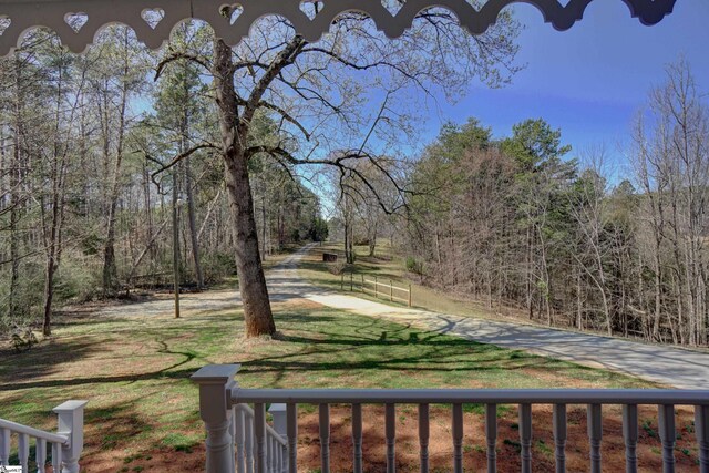 view of yard featuring a wooded view