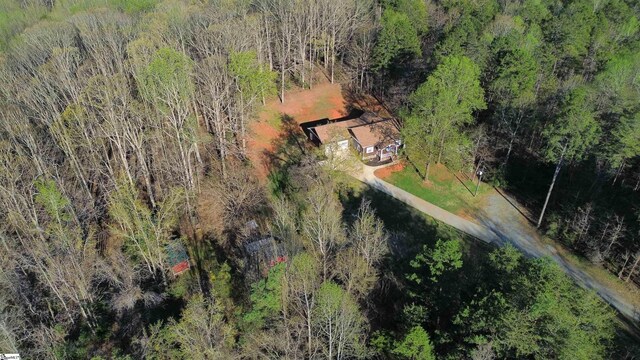 bird's eye view featuring a wooded view