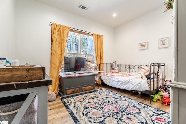 bedroom featuring visible vents, recessed lighting, and wood-type flooring