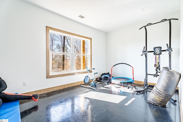 workout room with baseboards and visible vents