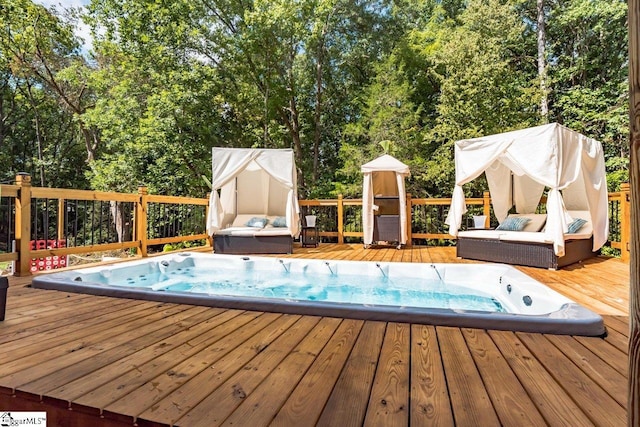 view of pool with a wooden deck and hot tub deck surround