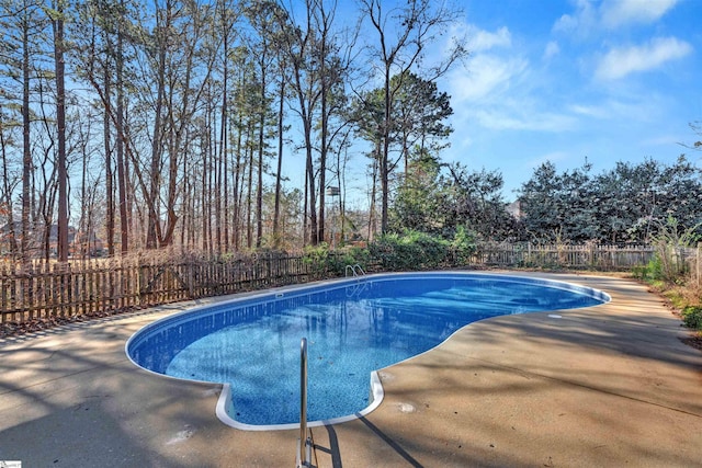 view of swimming pool with a fenced in pool, a patio, and a fenced backyard