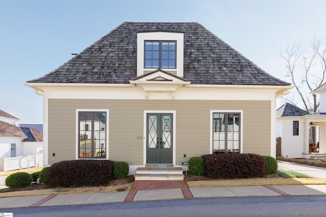 view of front of property with roof with shingles