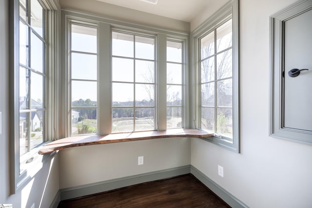 unfurnished sunroom featuring a wealth of natural light