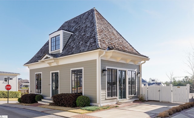 view of front of home with a gate and fence