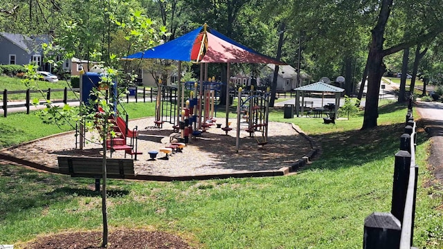 communal playground featuring a lawn