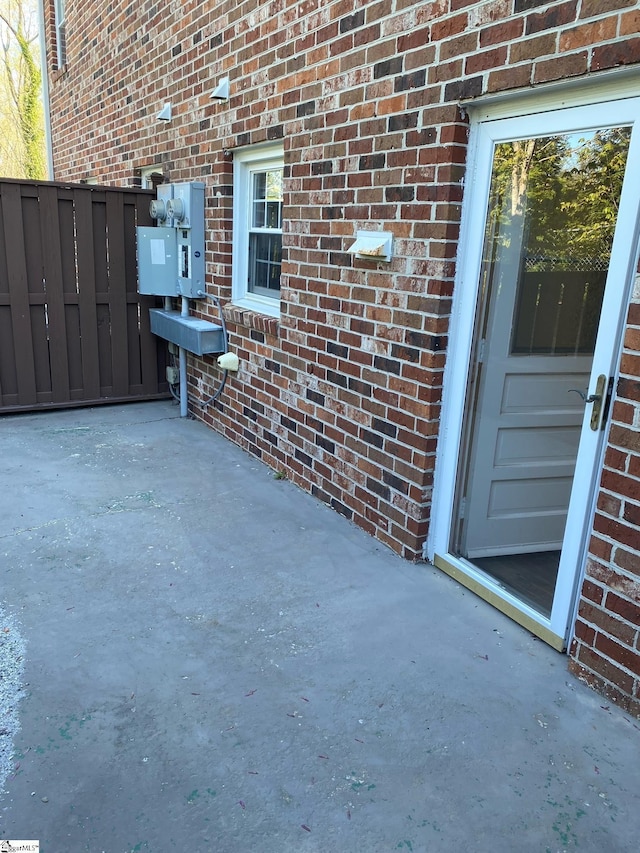 view of patio featuring fence