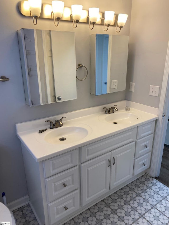 bathroom featuring double vanity and a sink