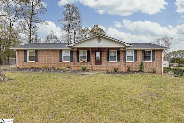 ranch-style house with a porch, brick siding, and a front yard
