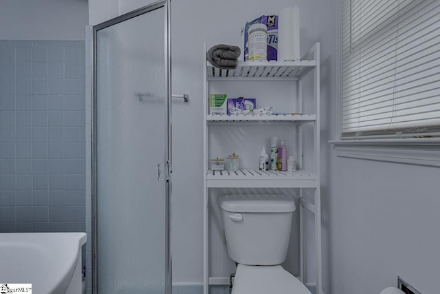 full bathroom with a shower with shower door, toilet, and a washtub