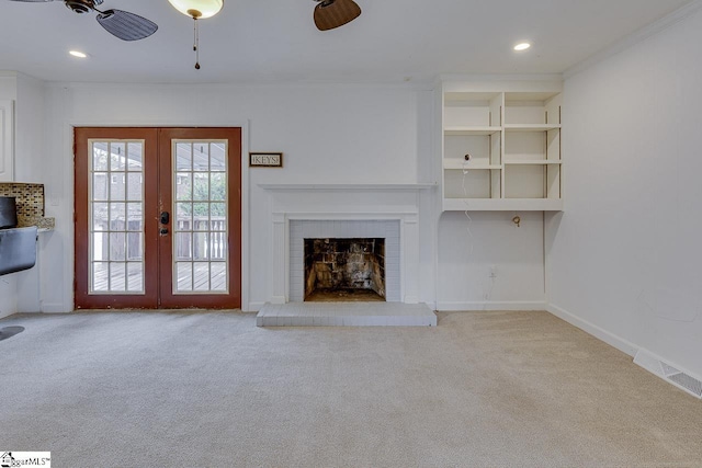 unfurnished living room featuring french doors, carpet flooring, recessed lighting, and visible vents