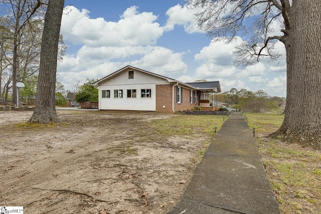 view of front of property featuring brick siding