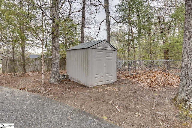 view of shed with fence