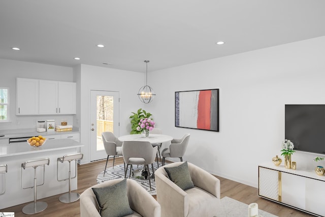 14 Polk Blvd, Greenville, SC 29611 - dining space featuring wood finished floors, a healthy amount of sunlight, recessed lighting, and a chandelier