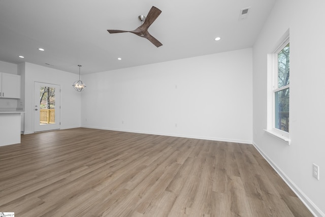 14 Polk Blvd, Greenville, SC 29611 - unfurnished living room featuring baseboards, visible vents, recessed lighting, and light wood-type flooring