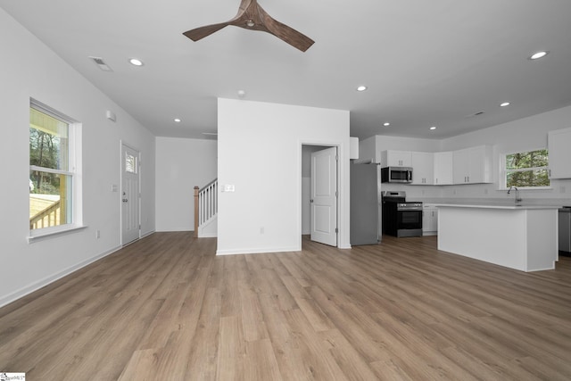14 Polk Blvd, Greenville, SC 29611 - unfurnished living room featuring a wealth of natural light, visible vents, light wood-style flooring, and recessed lighting