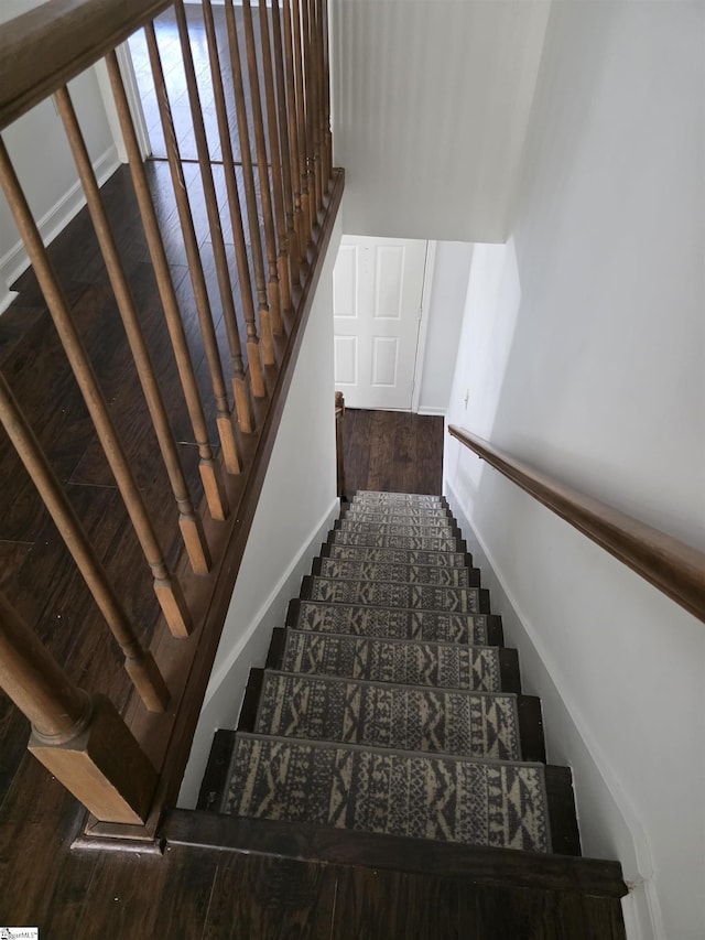 staircase featuring baseboards