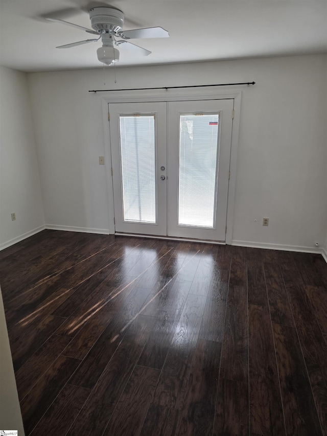spare room with french doors, a ceiling fan, dark wood-style flooring, and a wealth of natural light