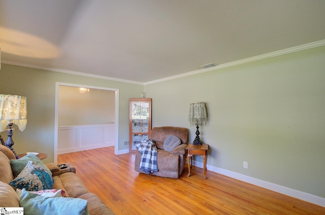 411 Westcliffe Way, Greenville, SC 29611 - living room featuring a wainscoted wall, crown molding, light wood-type flooring, a decorative wall, and visible vents
