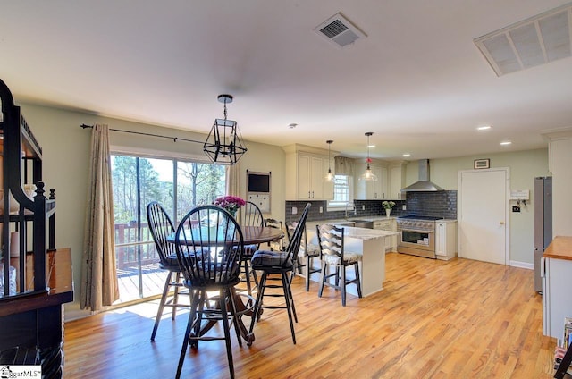 411 Westcliffe Way, Greenville, SC 29611 - dining space featuring a healthy amount of sunlight, light wood finished floors, and visible vents
