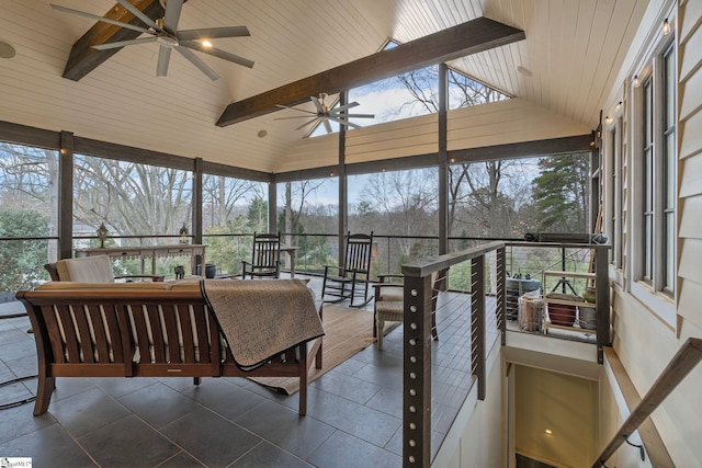 sunroom with an outdoor living space, a ceiling fan, and beamed ceiling