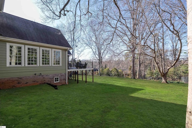 view of yard featuring a wooden deck