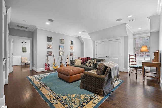 living room with visible vents and ornamental molding